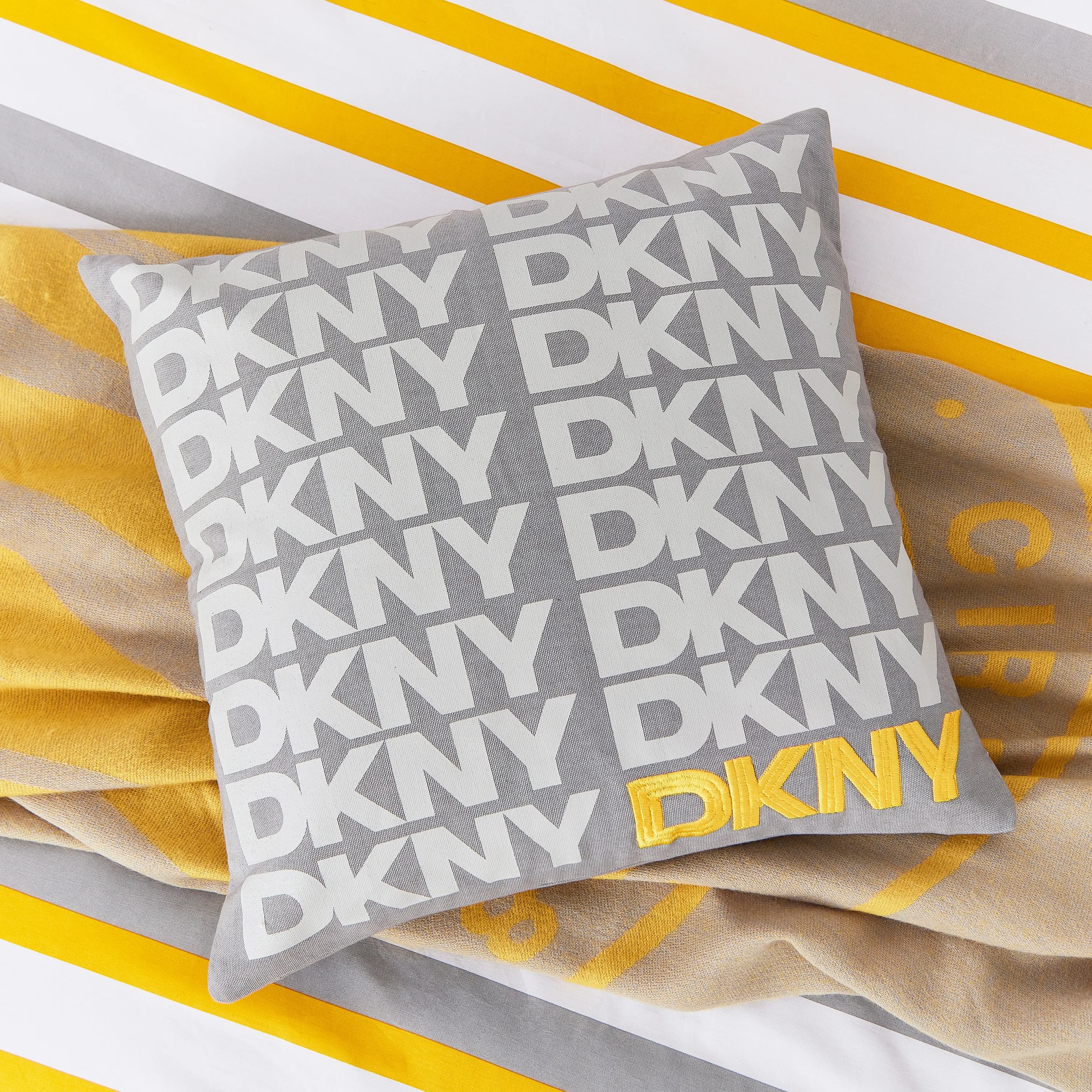 Logo Printed Cotton Cushion By Dkny In Grey Yellow